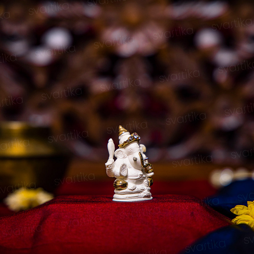 four armed ganesh car dashboard