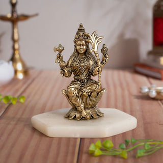 Brass Raja Rajeshwari Devi murti seated on a lotus in a composed four-armed form