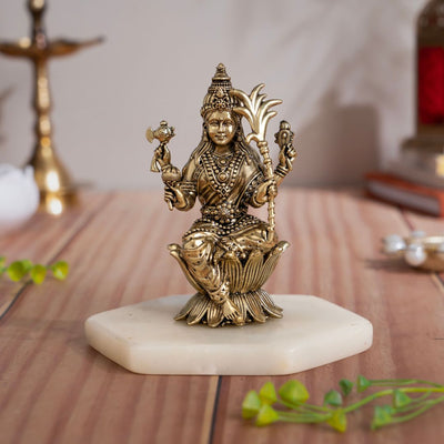 Brass Raja Rajeshwari Devi murti seated on a lotus in a composed four-armed form