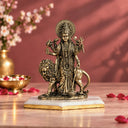 Brass standing Durga Maa murti with her lion, on a white marble base with a gold edge