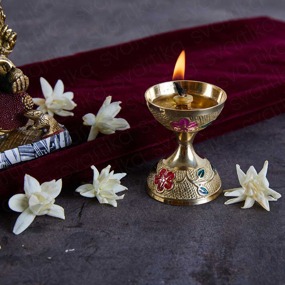 gold plated floral design diya