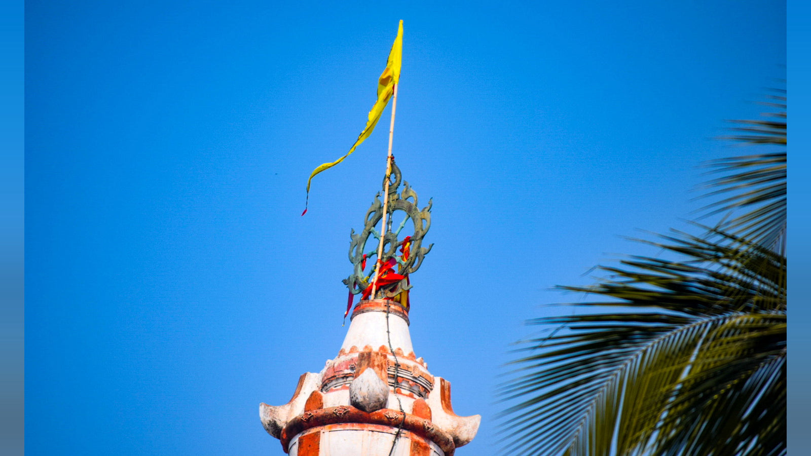 The Patitapabana Bana flying from the mast above the Nilachakra on the spire of the Jagannath Temple at Puri