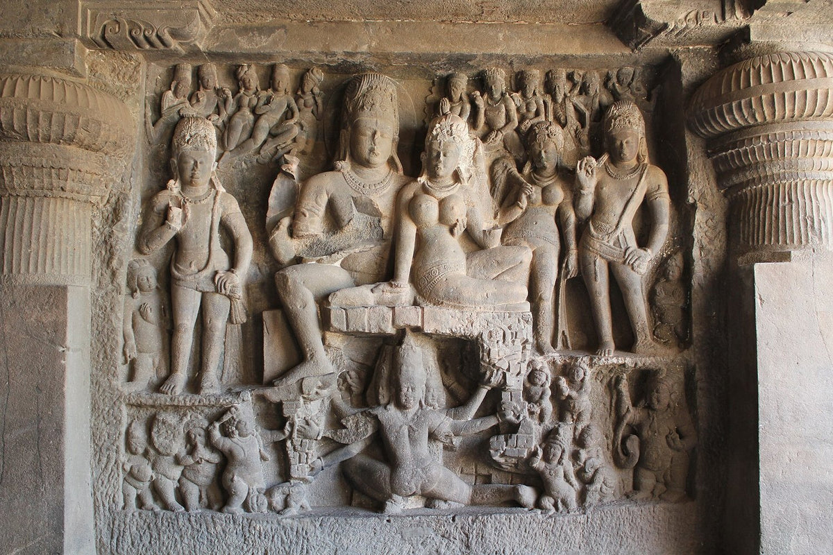 Rock-cut relief at Ellora: Shiva and Parvati seated on Mount Kailasa while the many-armed Ravana tries to shake the mountain from below
