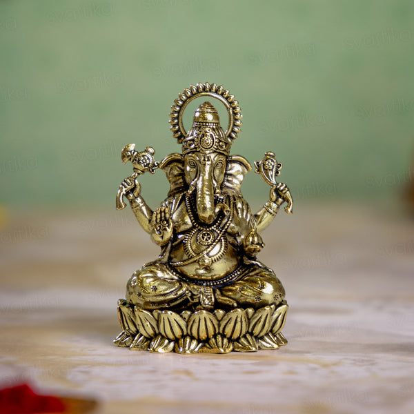 Brass Left-Trunk Ganesha Murti Sitting On Lotus (3 Inch)