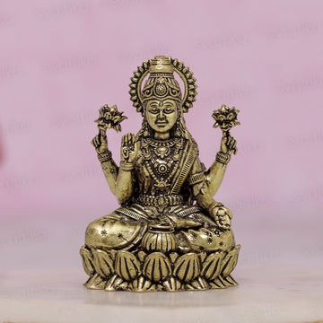 brass sitting lakshmi idol