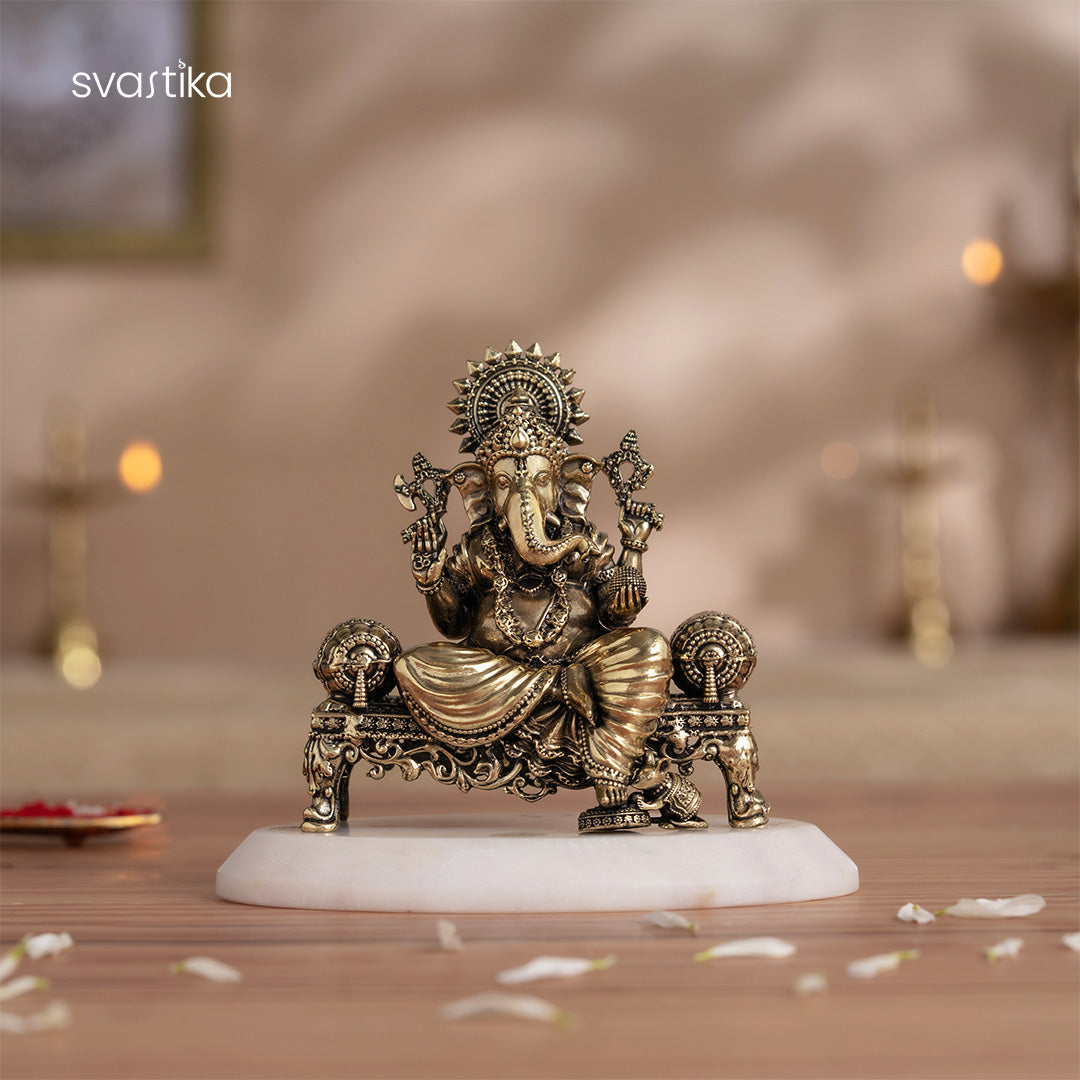 ganesh idol sitting on sinhasan brass idol