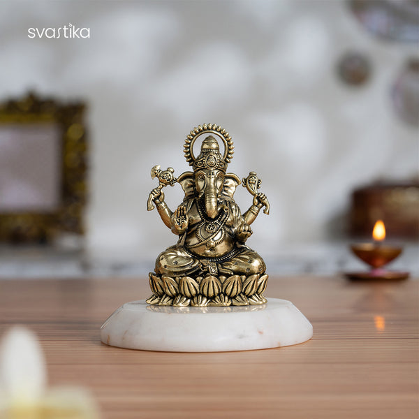 Brass Left-Trunk Ganesha Murti Sitting On Lotus (3 Inch)