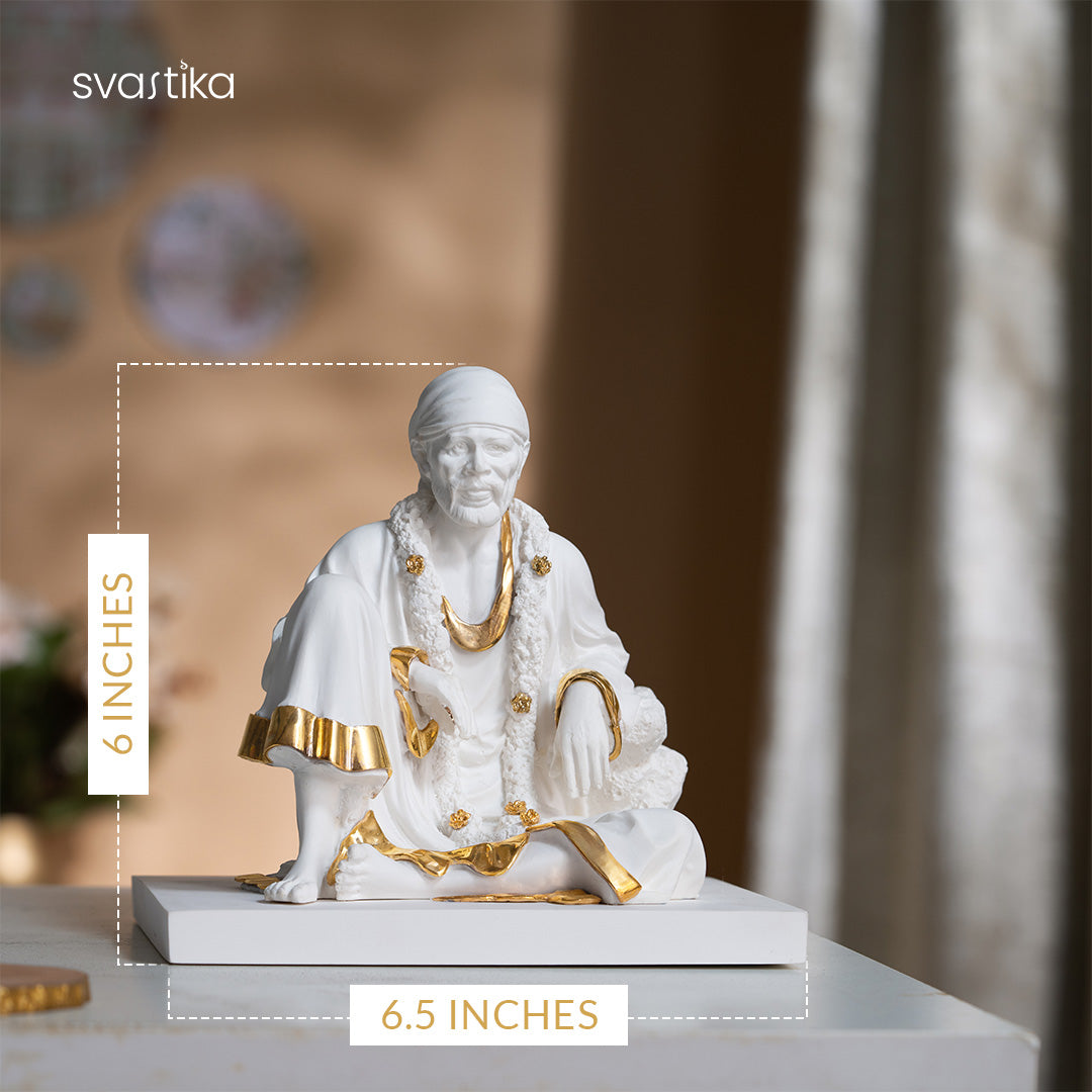 White and gold Sai Baba marble dust idol