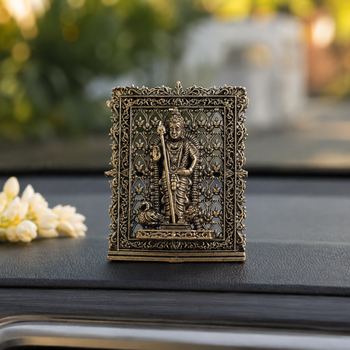 Brass framed Lord Murugan idol for car dashboard, close view