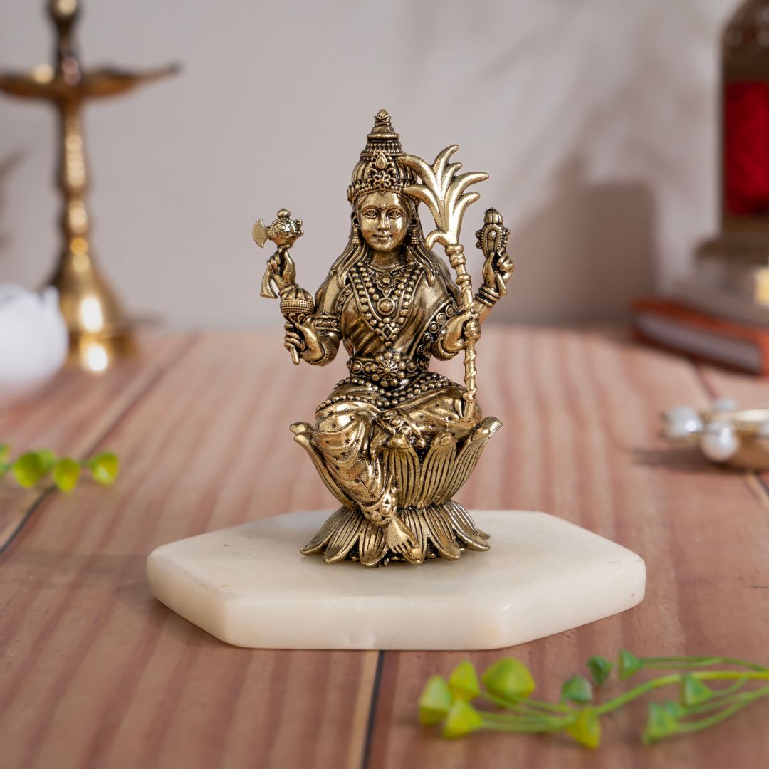 Brass Raja Rajeshwari Devi murti seated on a lotus in a composed four-armed form