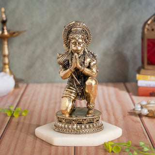 Brass Ram Bhakt Hanuman murti kneeling in Anjali Mudra with folded hands beneath an ornate prabhavali