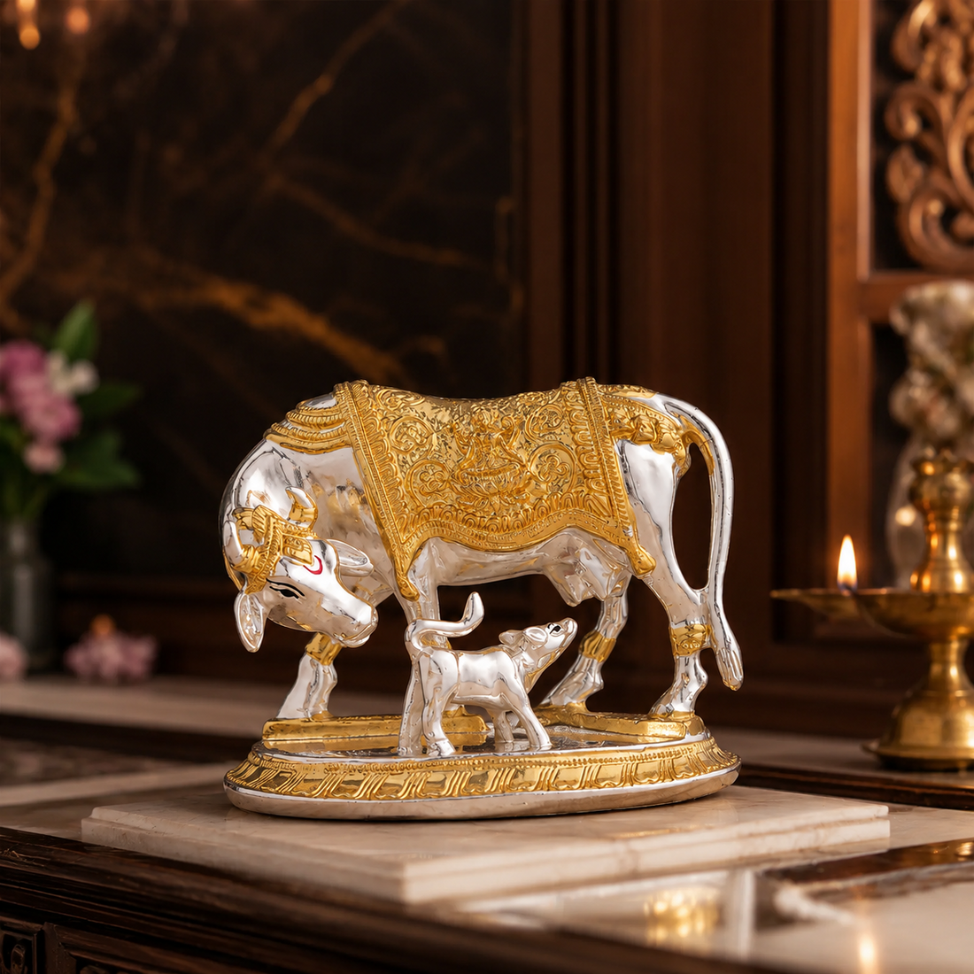 Svastika Kamdhenu cow with calf gold and silver plated idol detailed front view