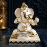 Pooja Ganesha idol in white and gold, close-up view